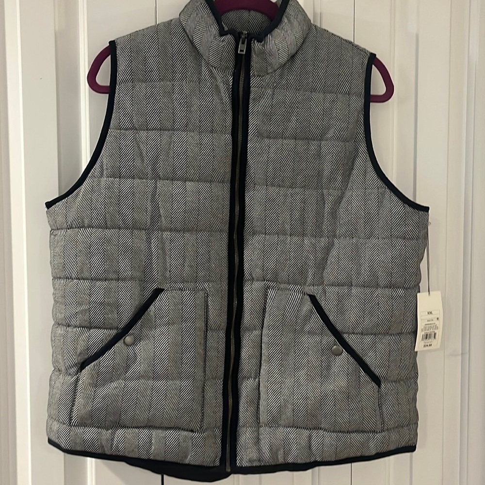 Black and white puffed vest. Soft fabric, not water proof.